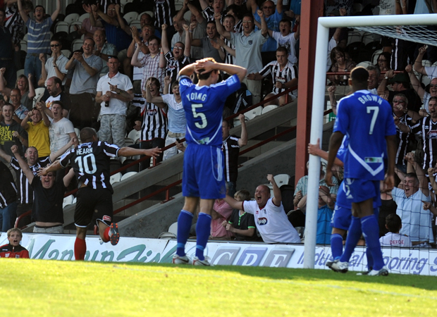 Liam Hearn celebrates after scoring for Grimsby Town